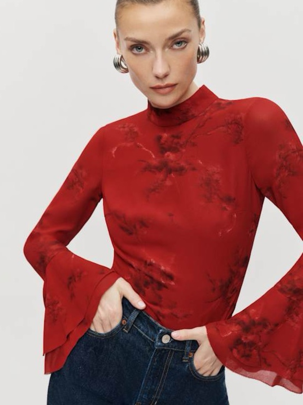 Roxana top in a vermillion red floral print, featuring a mock neck & flutter sle - Picture 2 of 13